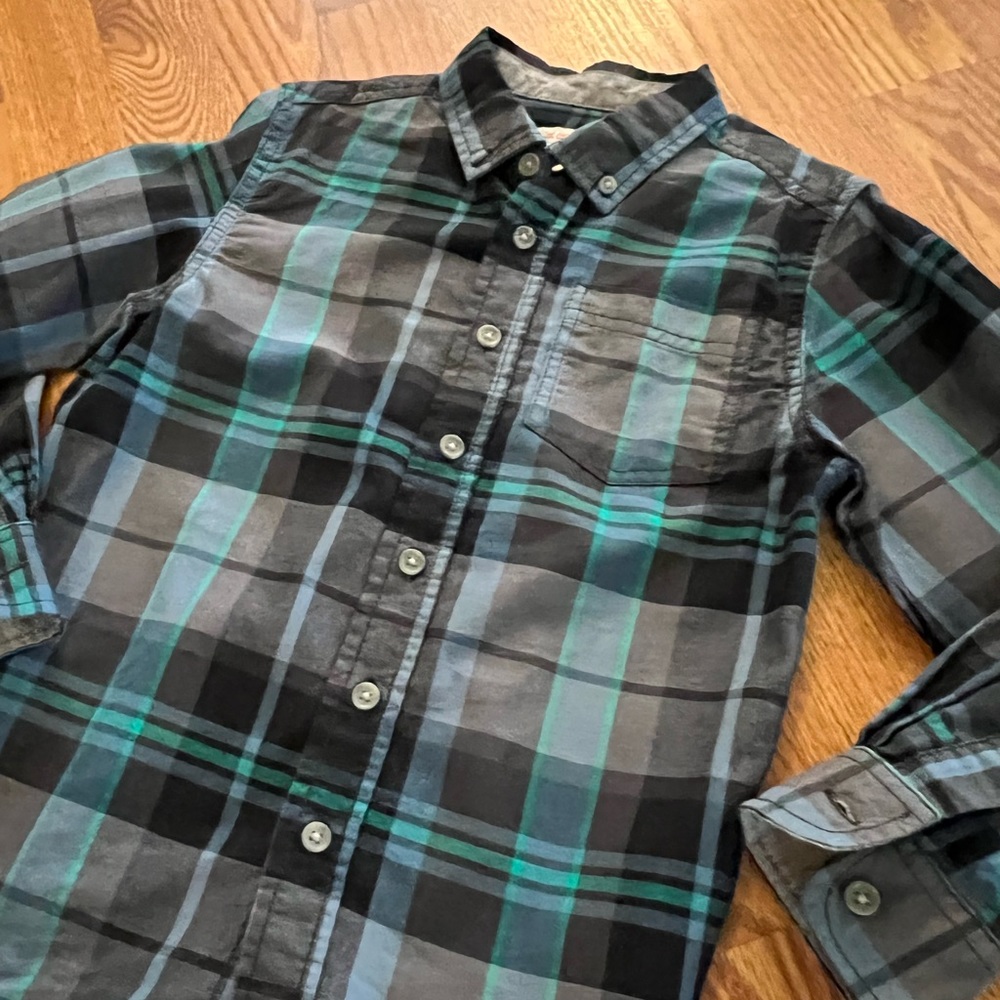 Adorable and unique turquoise, blue, black and gray plaid button down shirt.